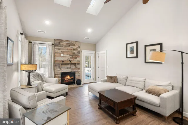 a living room with furniture fireplace and a fireplace