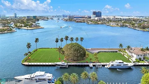 aerial view of a house with a lake view