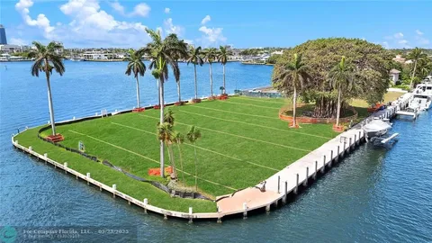 a view of a lake with lawn chairs