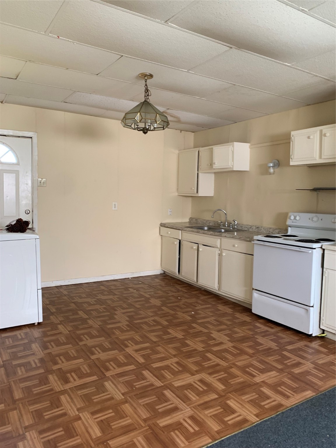 a kitchen with granite countertop a sink cabinets stainless steel appliances and a counter top