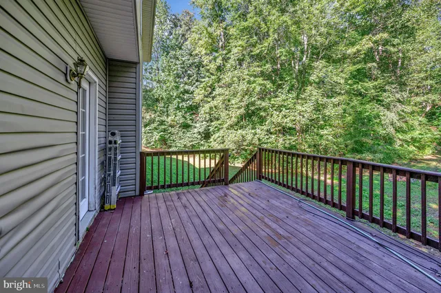 a view of a balcony with wooden floor