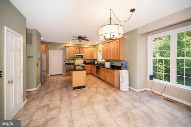 a view of a living room and kitchen