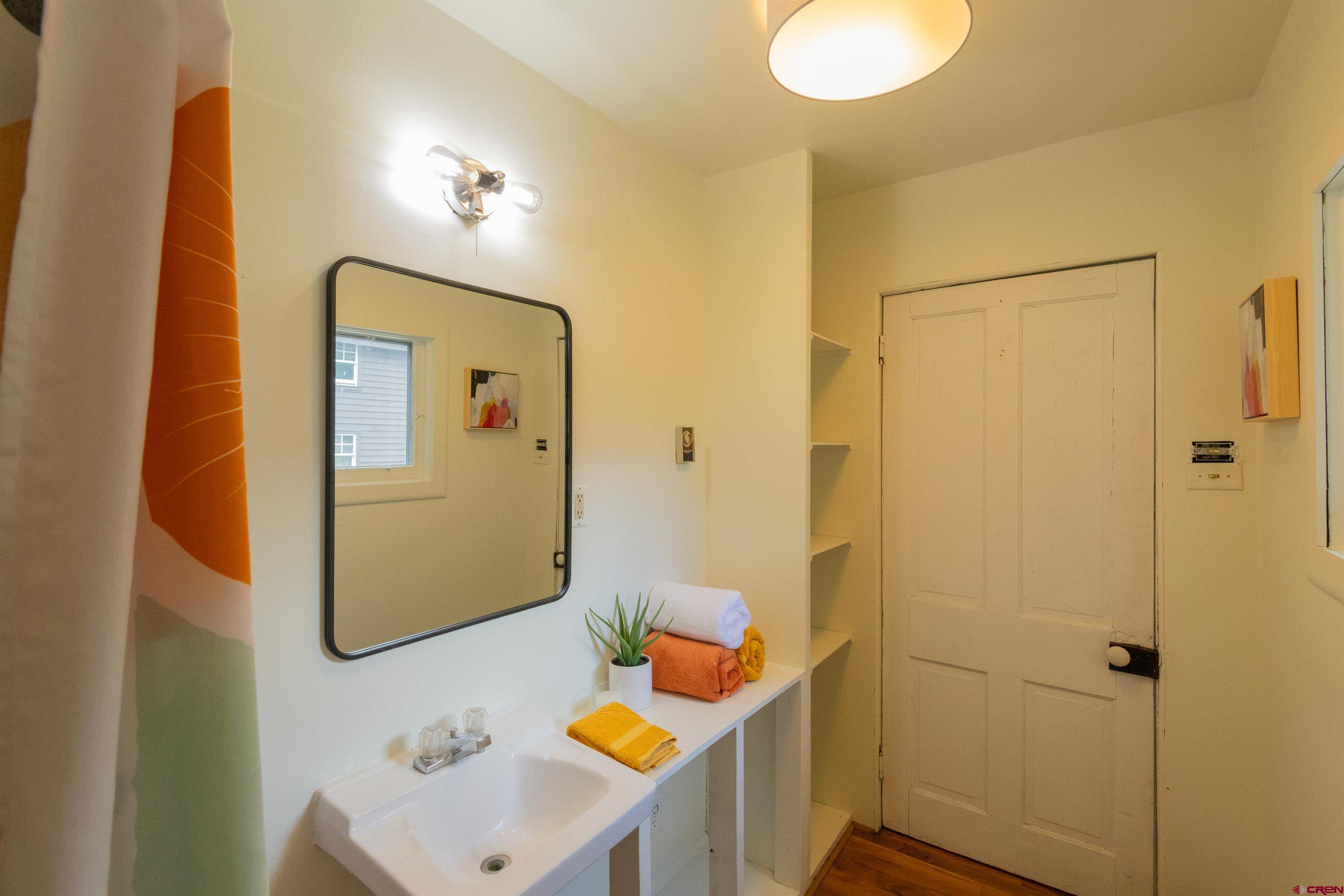 322 Maroon Avenue Crested Butte, CO 81224 - Photo 14 of 24 a bathroom with a sink toilet and shower