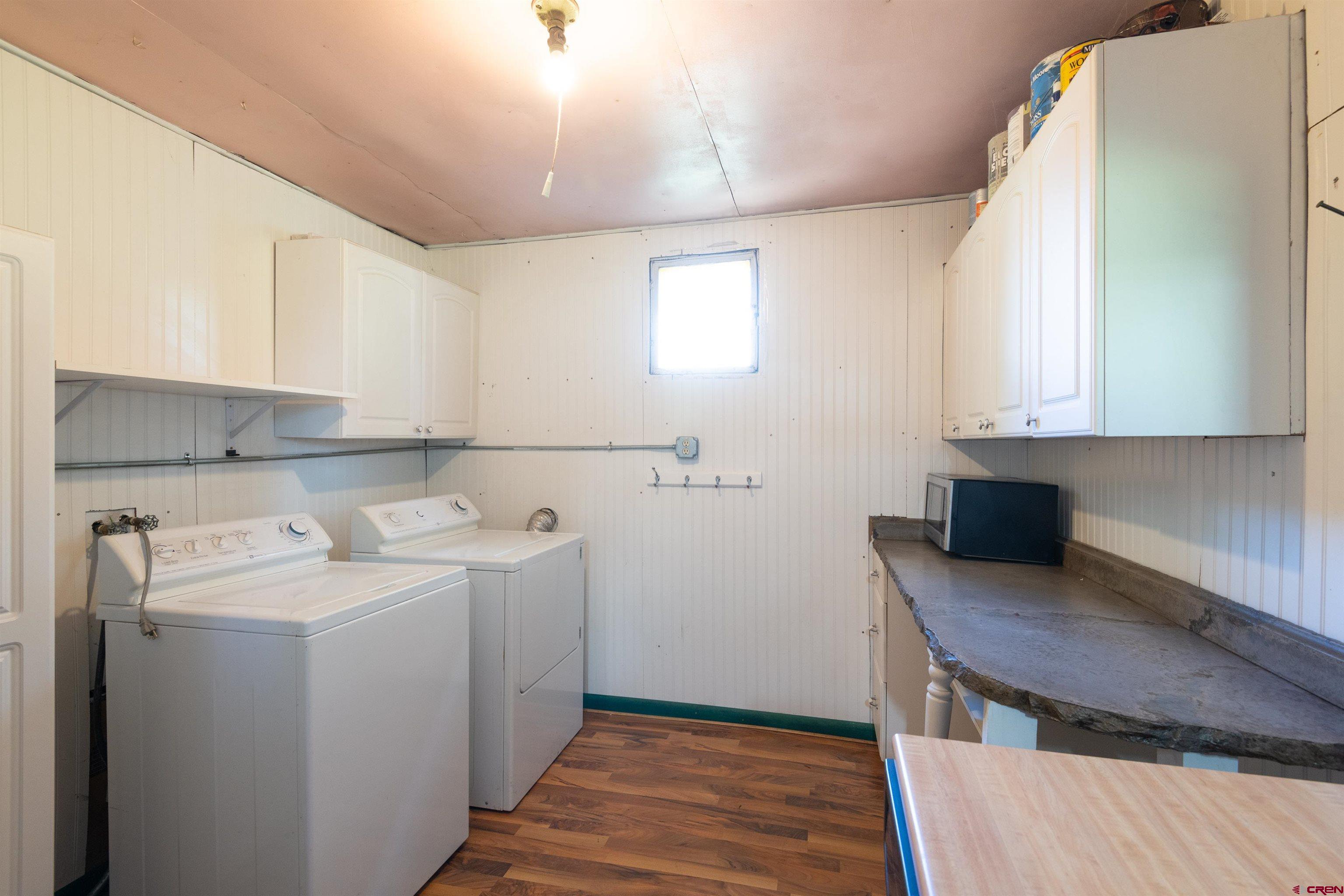 322 Maroon Avenue Crested Butte, CO 81224 - Photo 16 of 24 a utility room with cabinets washer and dryer