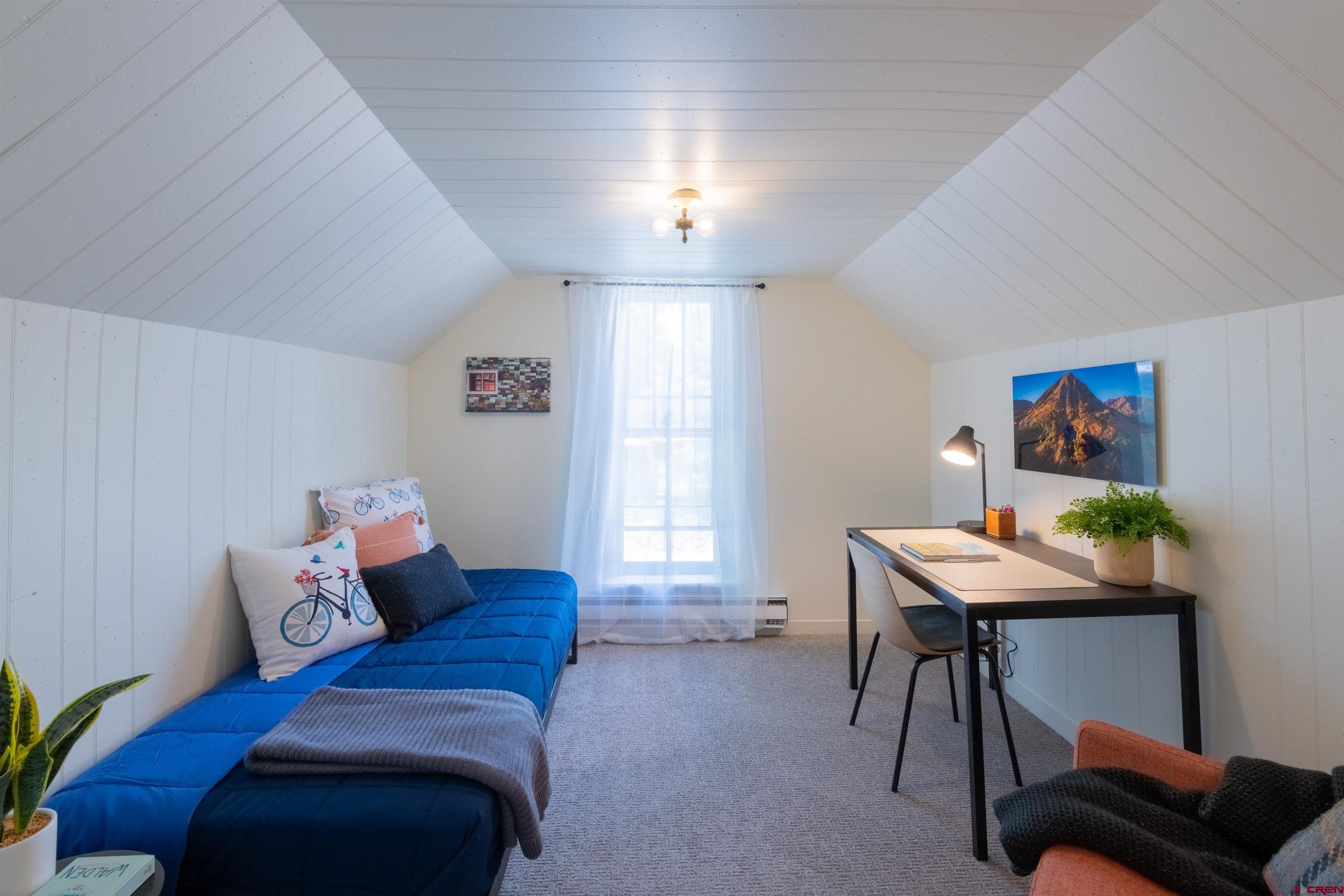 322 Maroon Avenue Crested Butte, CO 81224 - Photo 20 of 24 a living room with furniture and a window