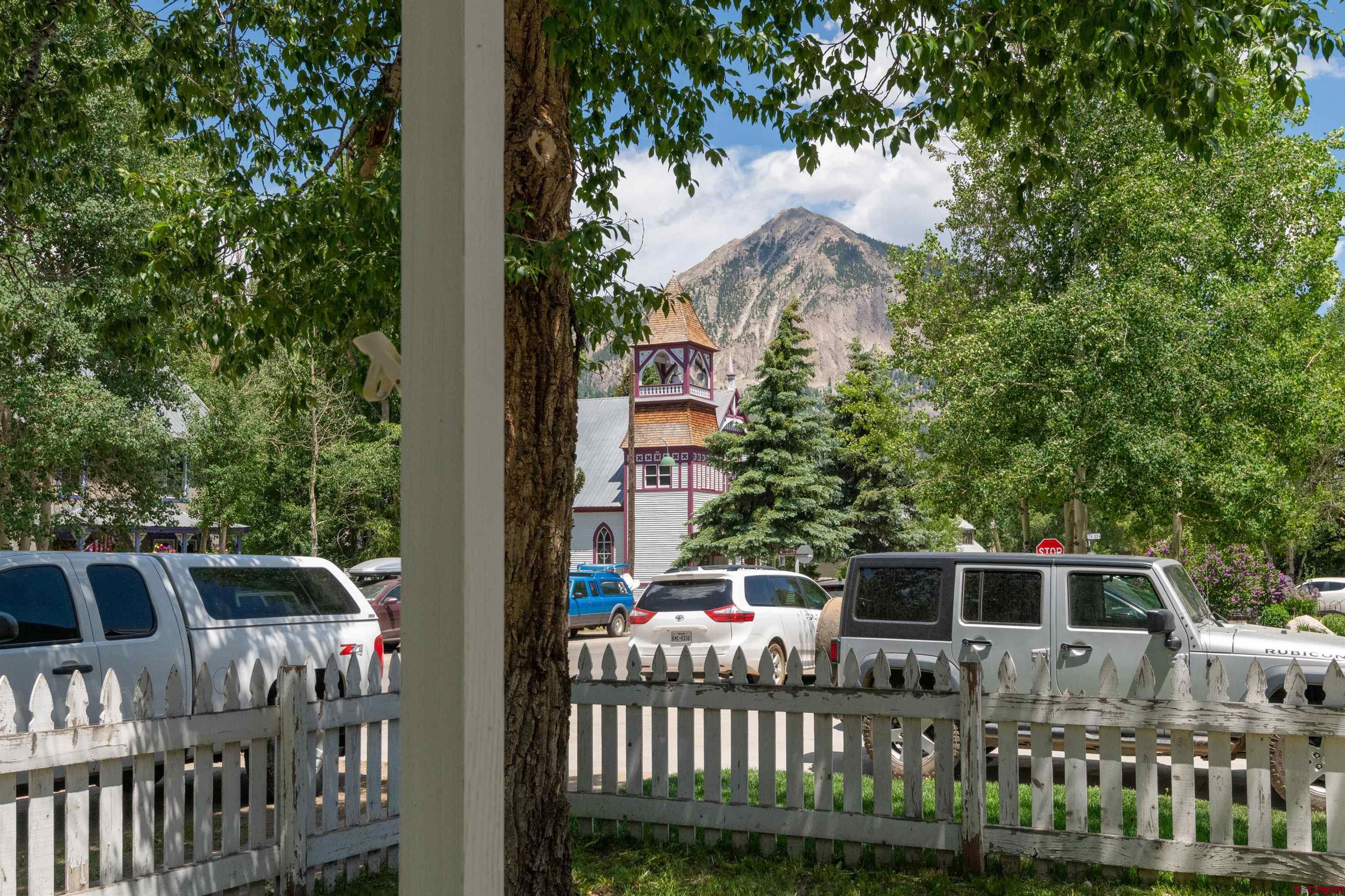 322 Maroon Avenue Crested Butte, CO 81224 - Photo 2 of 24 a front view of house with yard seating and trees