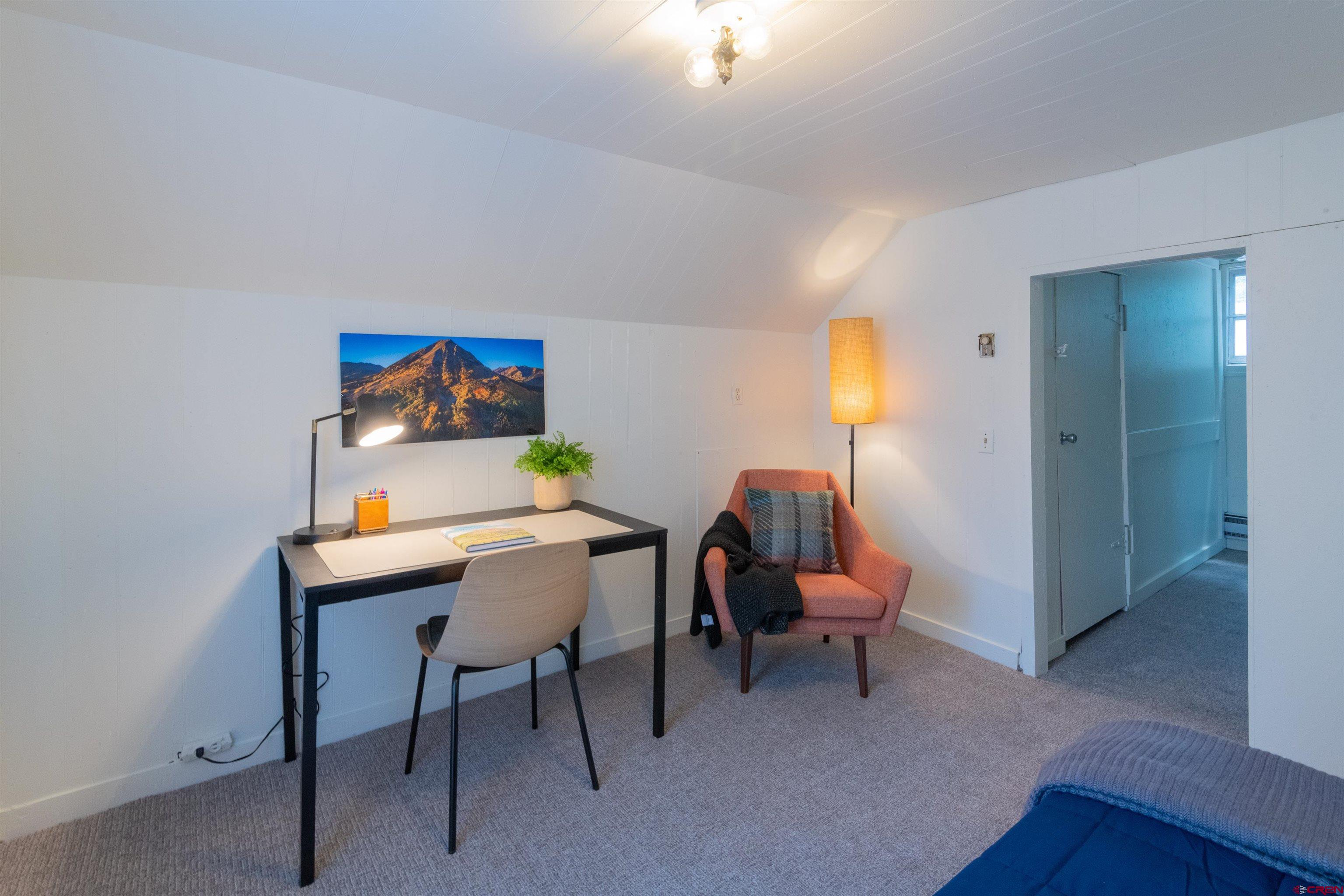322 Maroon Avenue Crested Butte, CO 81224 - Photo 21 of 24 a view of a workspace with furniture and lamp