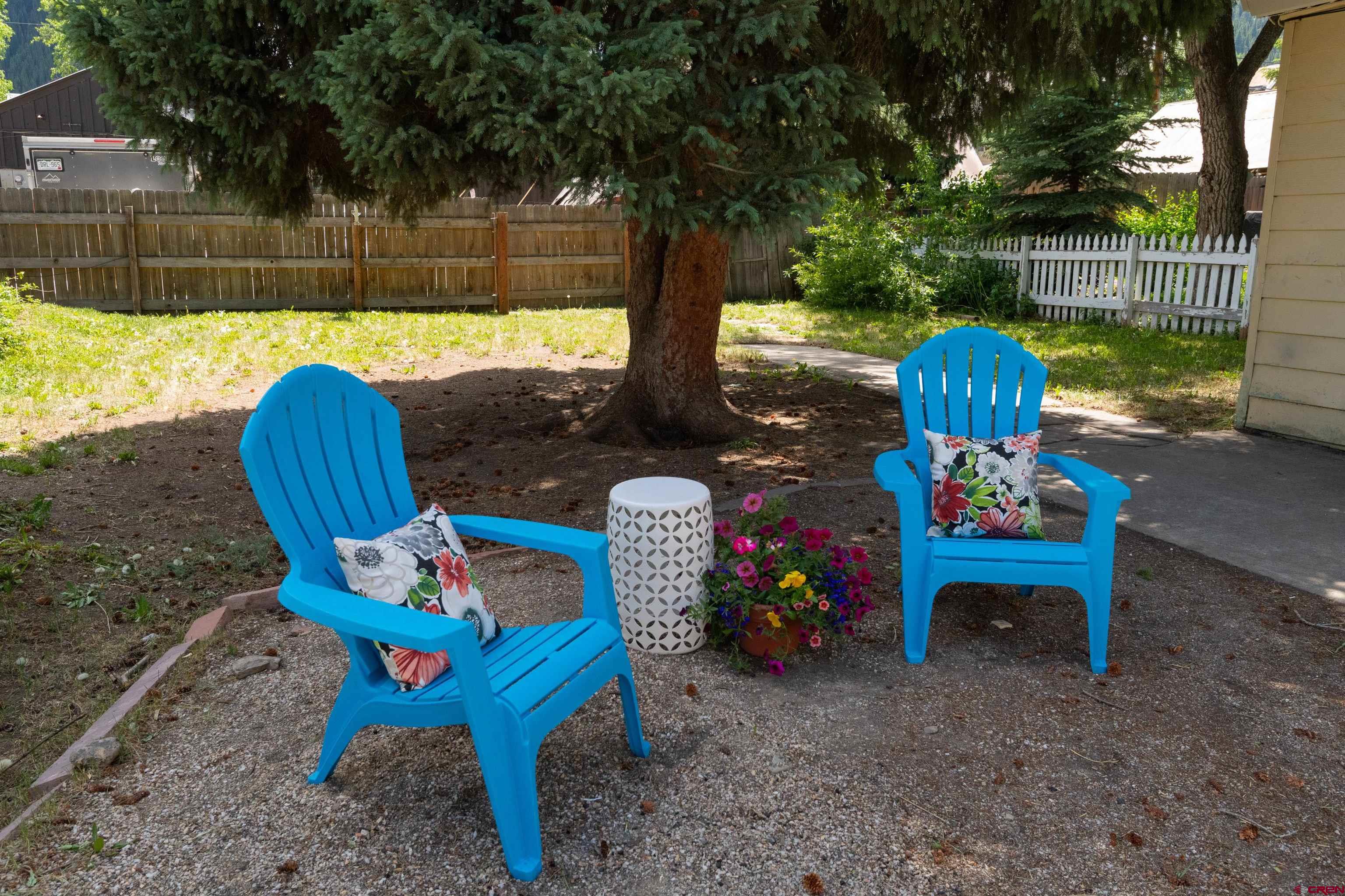 322 Maroon Avenue Crested Butte, CO 81224 - Photo 22 of 24 a table and chairs in a backyard