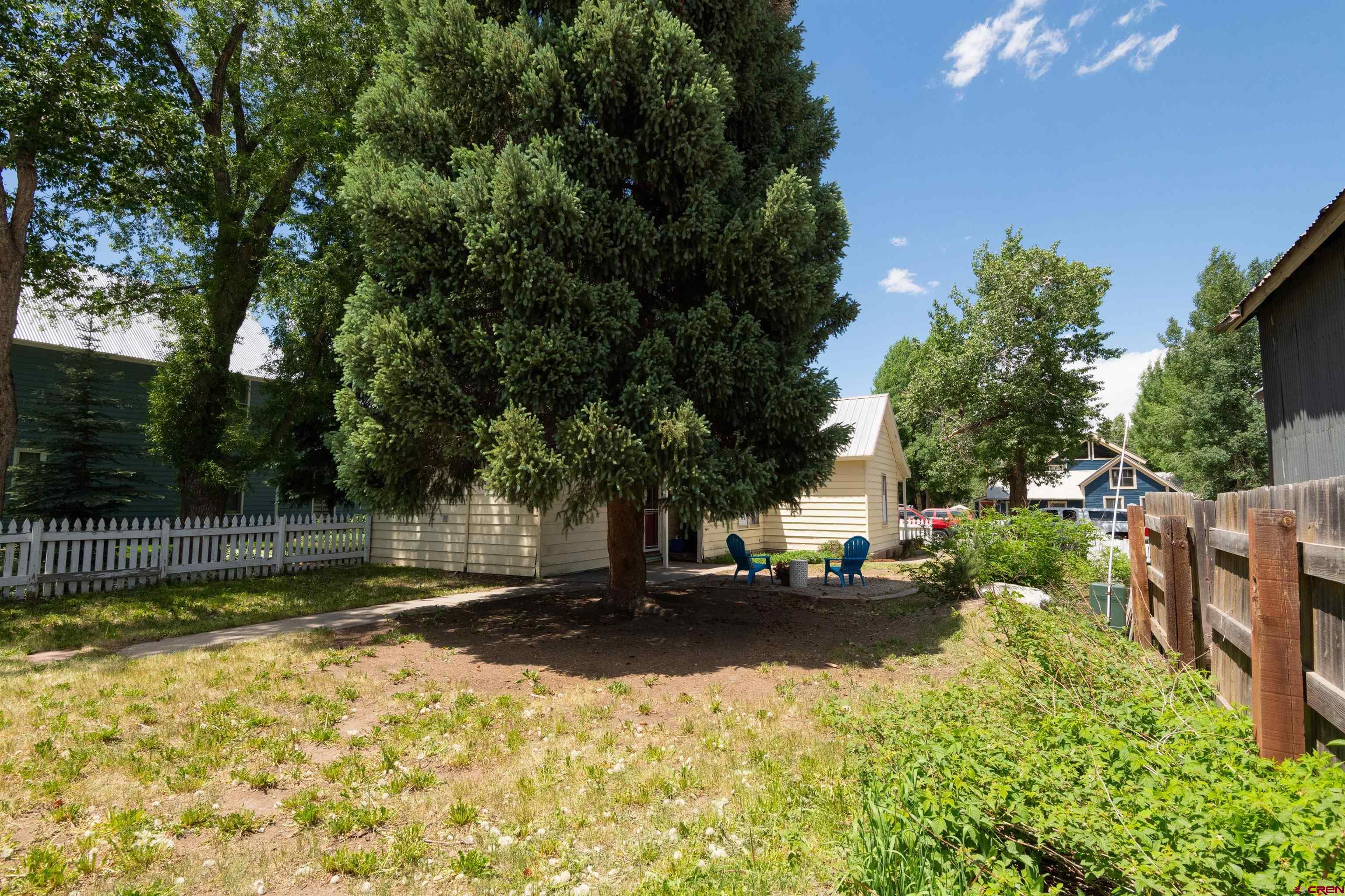 322 Maroon Avenue Crested Butte, CO 81224 - Photo 24 of 24 a backyard of a house with lots of green space