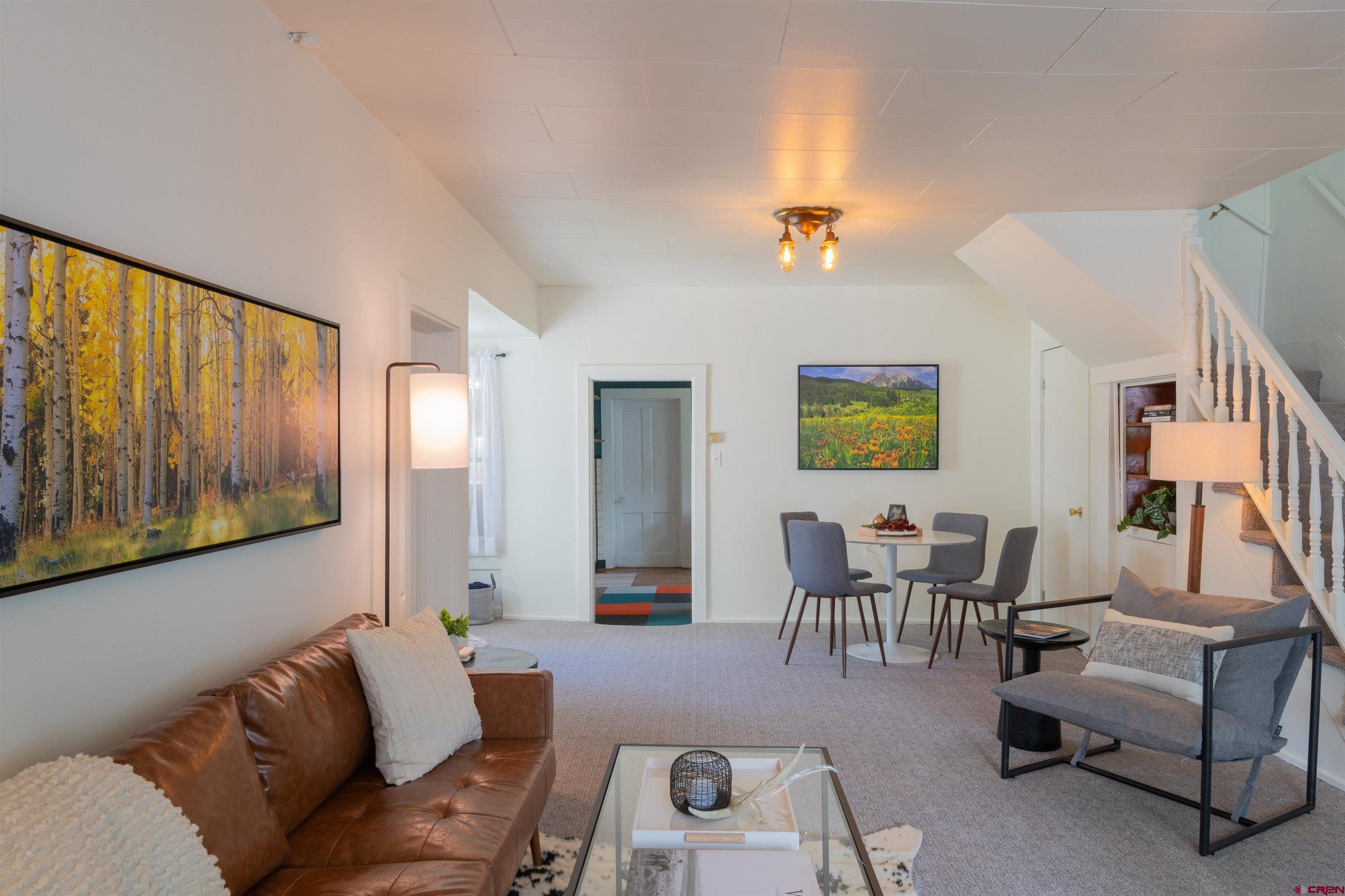322 Maroon Avenue Crested Butte, CO 81224 - Photo 4 of 24 a living room with furniture and wooden floor