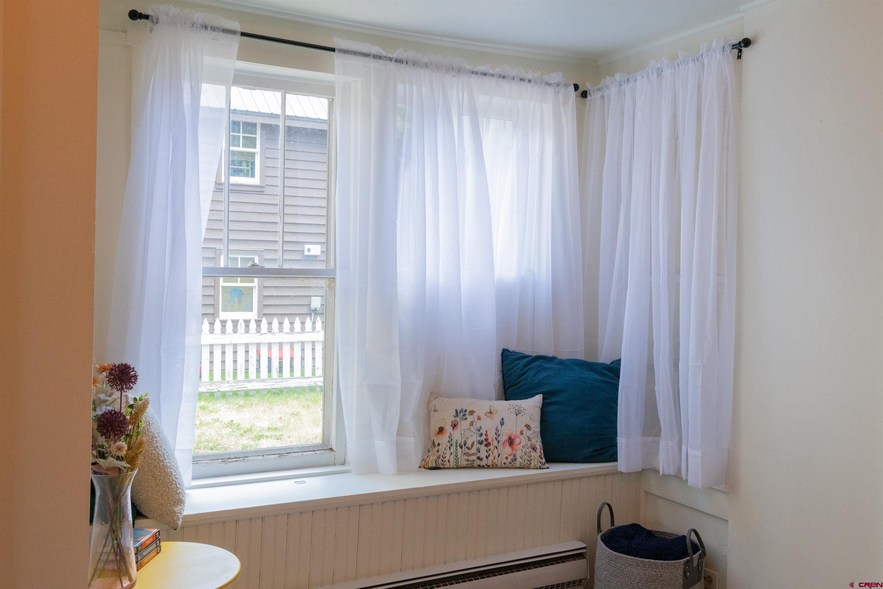 322 Maroon Avenue Crested Butte, CO 81224 - Photo 7 of 24 a room with a window and a potted plant