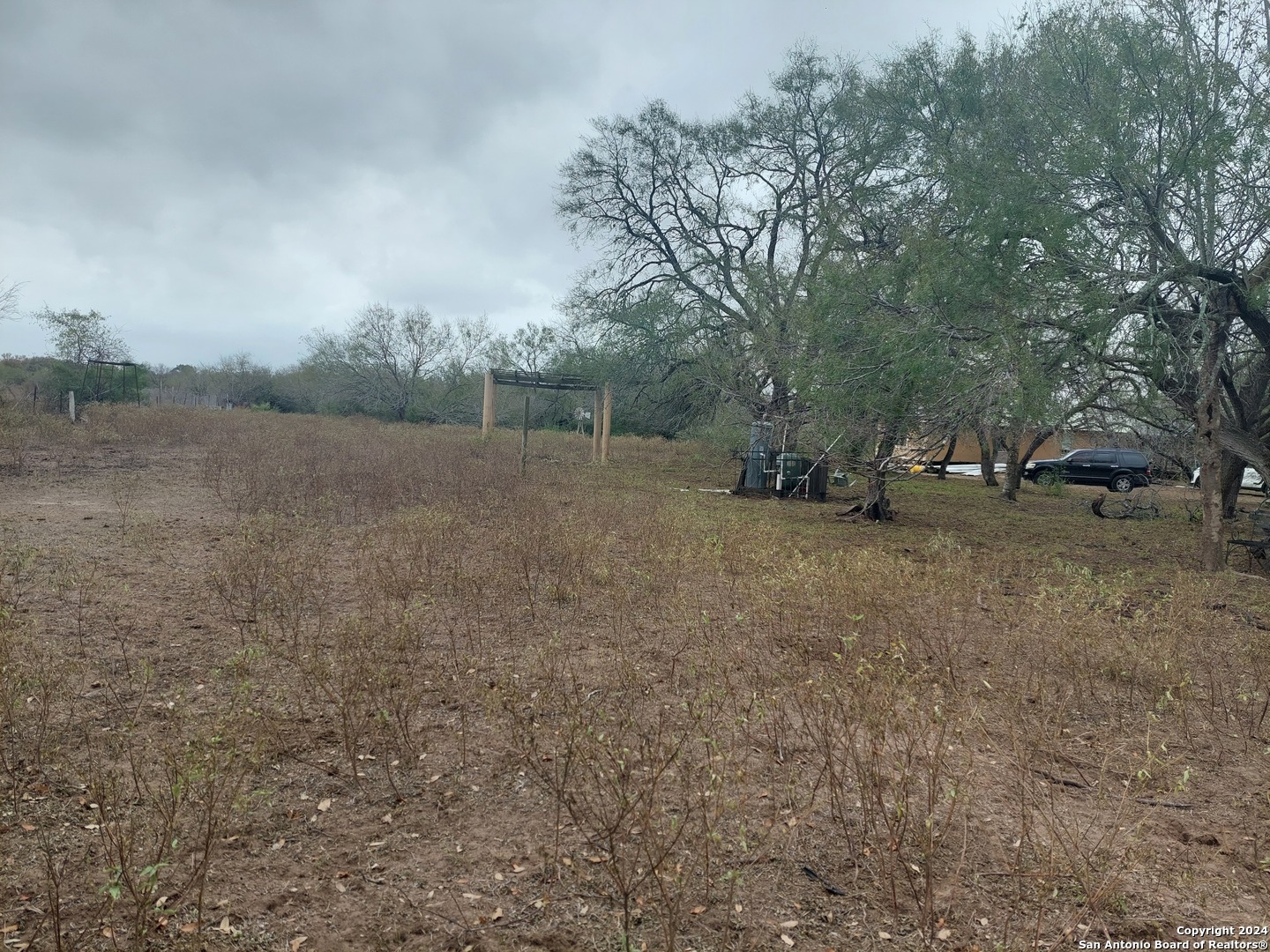 22159 Pr 1080 Mathis, TX 78368 - Photo 2 of 15 a view of dirt field with large trees