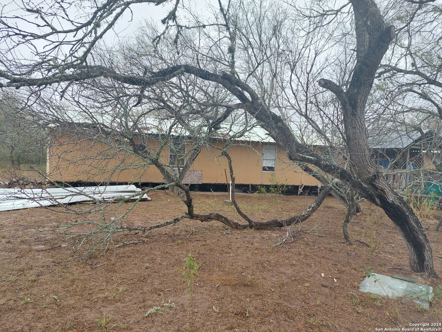 22159 Pr 1080 Mathis, TX 78368 - Photo 4 of 15 a view of a backyard with large trees
