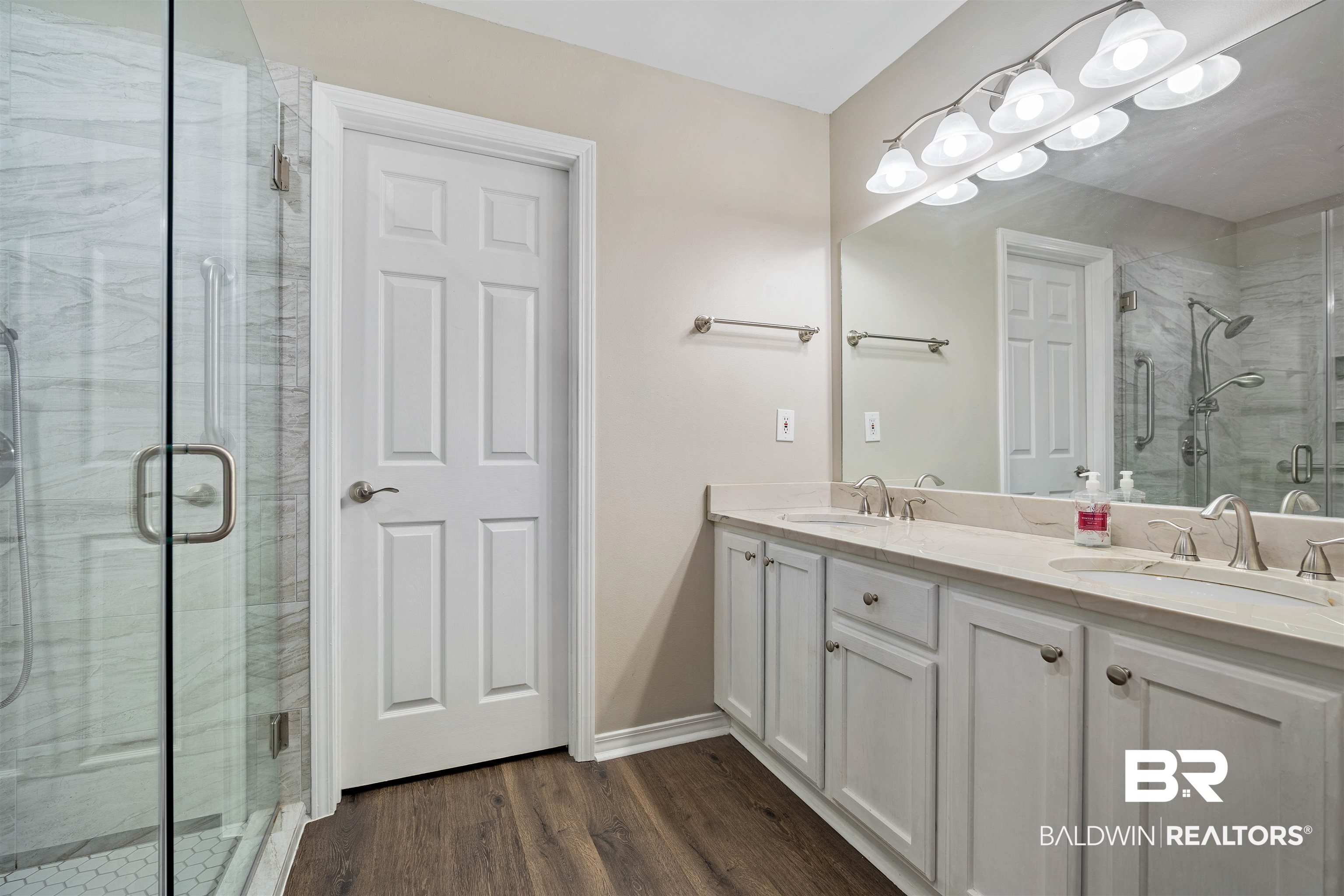 628 Spring Lake Court Mobile, AL 36695 - Photo 19 of 25 Bathroom featuring vanity, hardwood / wood-style floors, and walk in shower