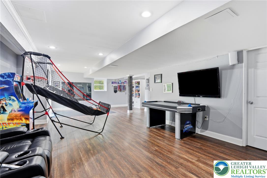 1212 Miller Road Wind Gap, PA 18091 - Photo 53 of 72 Entertain with ease in this spacious recreation room, featuring durable flooring and recessed lighting.