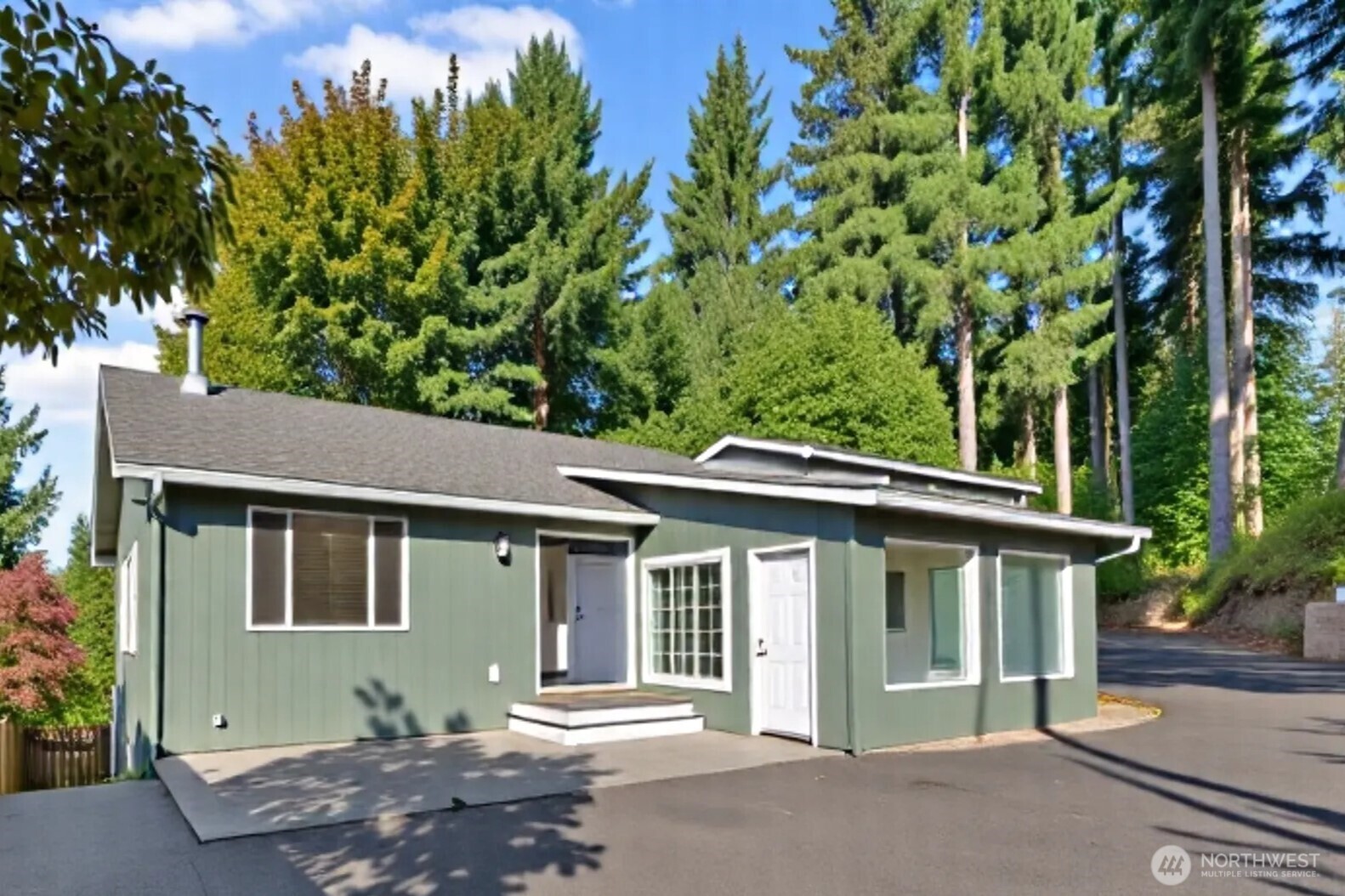 5502 Northeast 10th Street Renton, WA 98059 - Photo 1 of 27 front view of a house with a garden