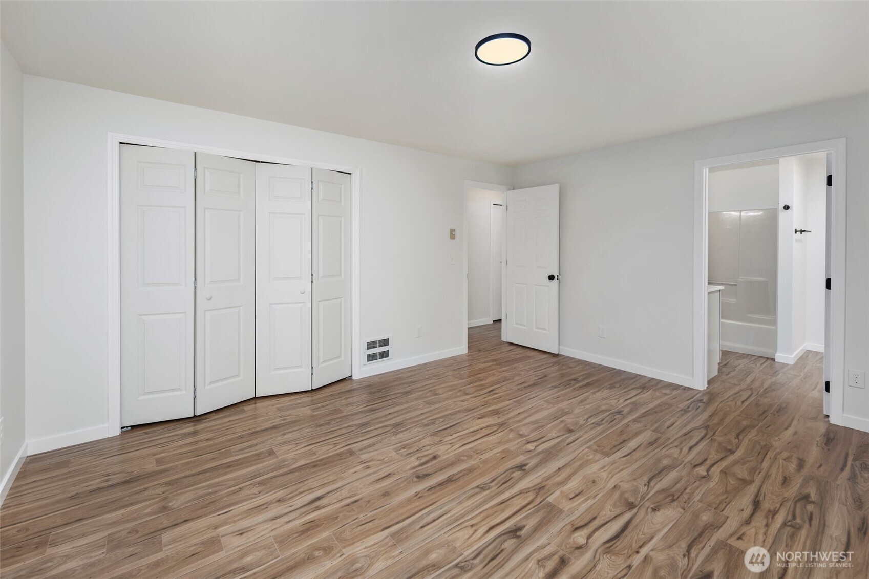 5502 Northeast 10th Street Renton, WA 98059 - Photo 16 of 27 a view of empty room with wooden floor