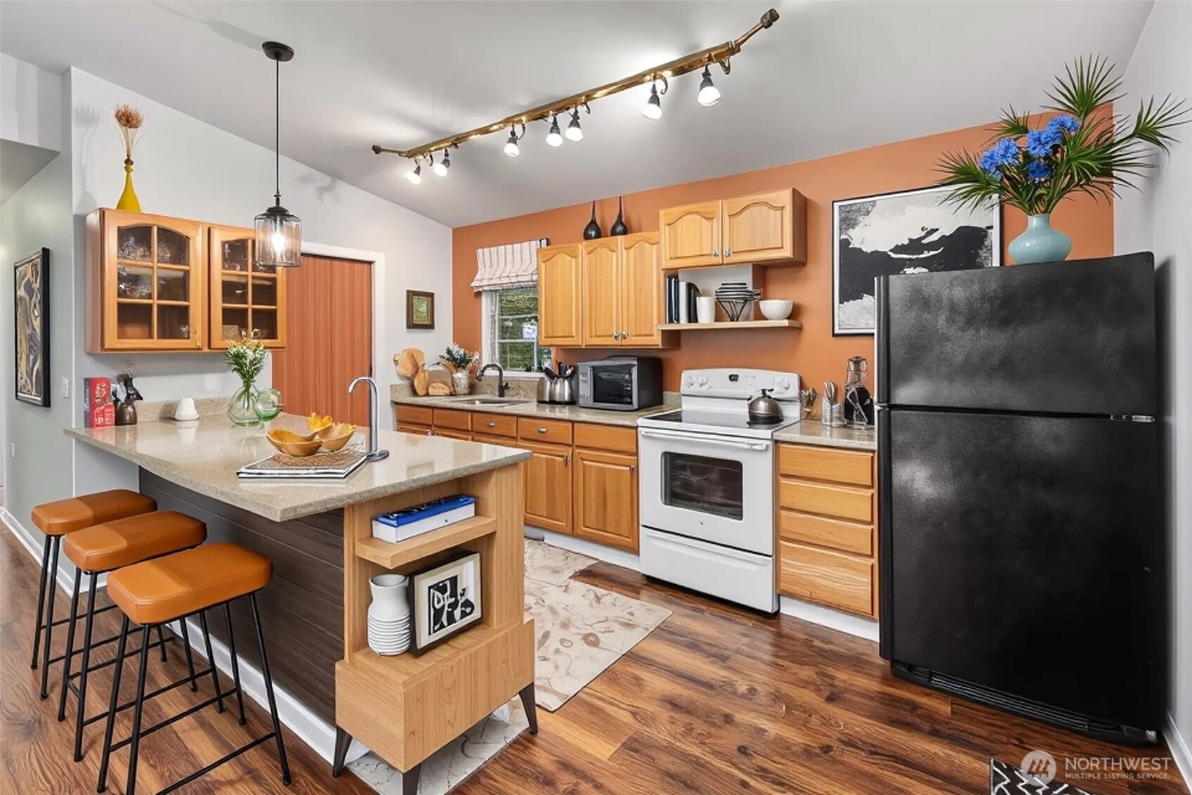 5502 Northeast 10th Street Renton, WA 98059 - Photo 19 of 27 a kitchen with stainless steel appliances granite countertop a stove refrigerator and a sink