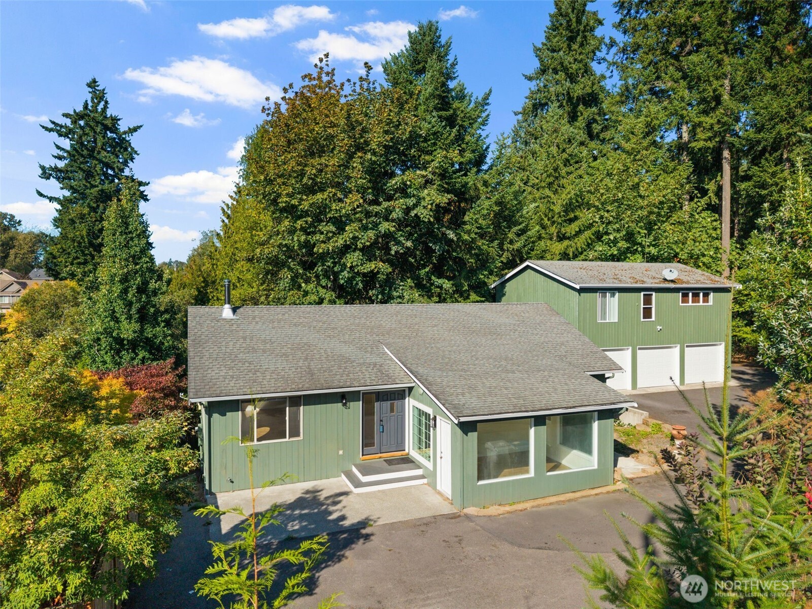 5502 Northeast 10th Street Renton, WA 98059 - Photo 2 of 27 a house that has a tree in front of it