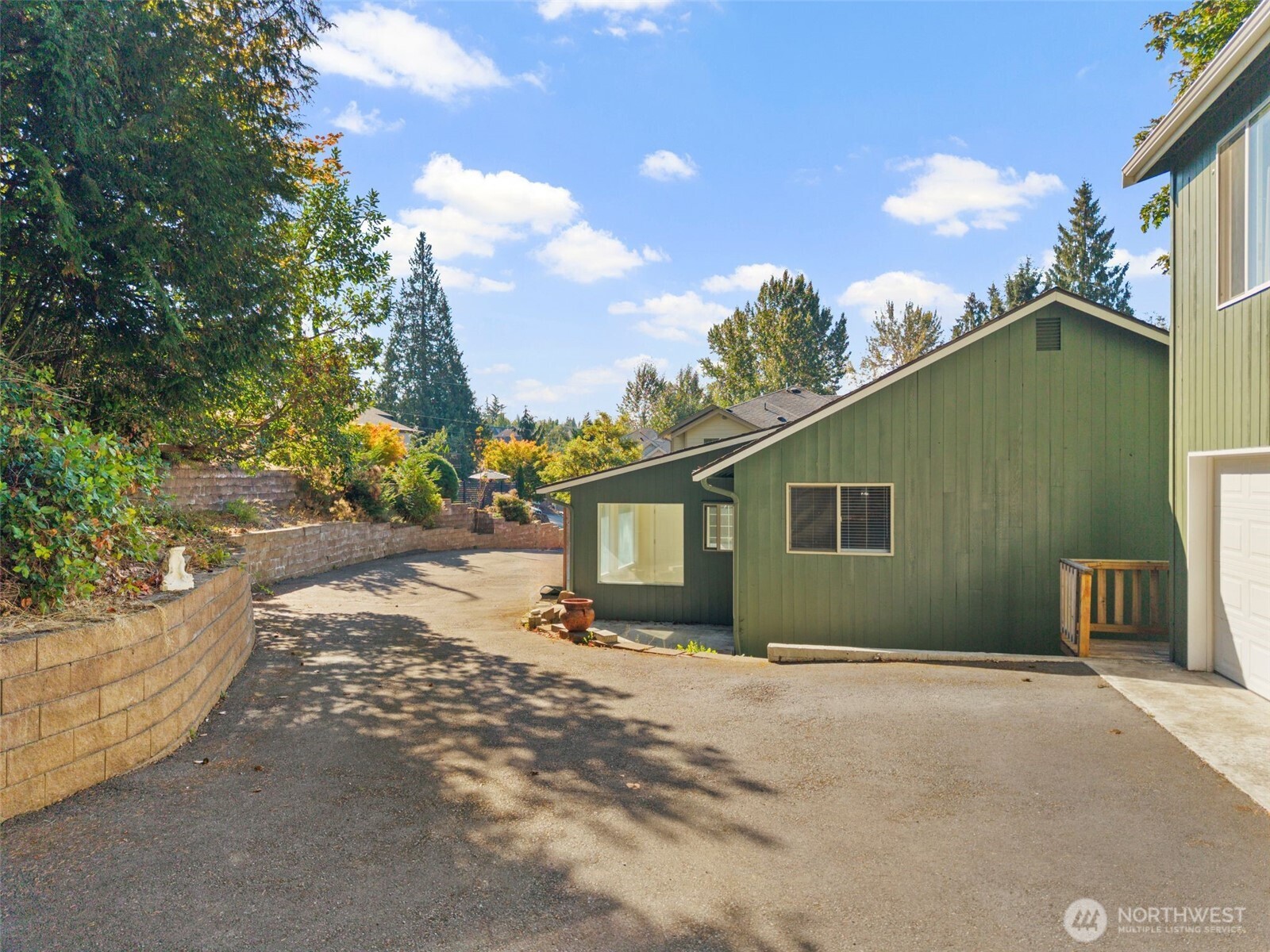 5502 Northeast 10th Street Renton, WA 98059 - Photo 26 of 27 a backyard of a house with table and chairs