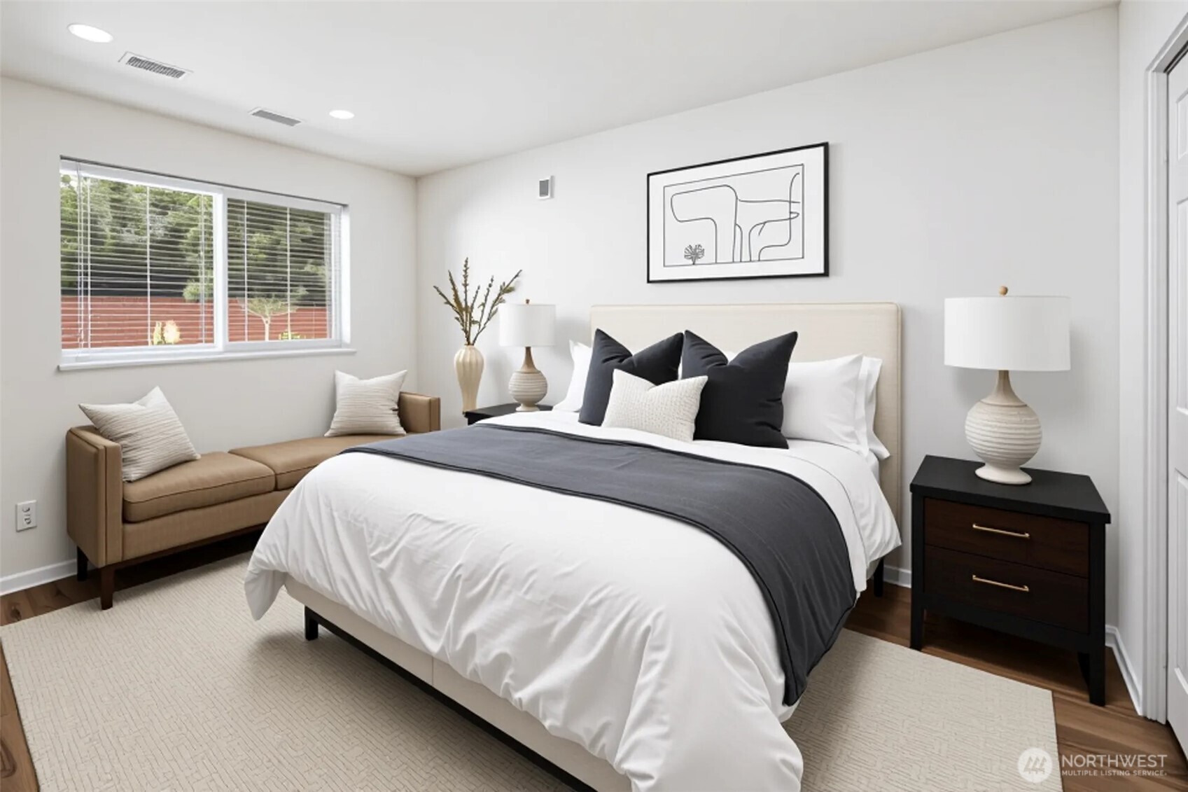 5502 Northeast 10th Street Renton, WA 98059 - Photo 9 of 27 a bedroom with a bed and a couch