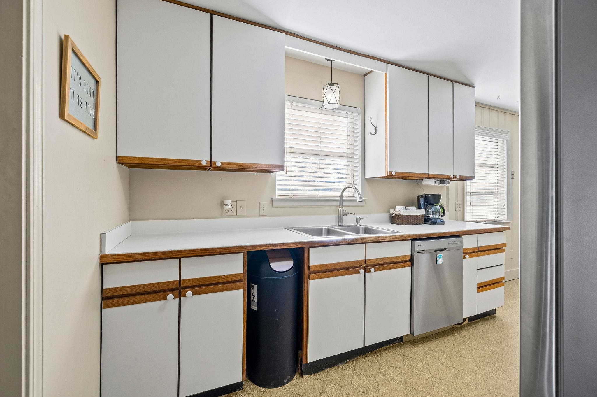 1002 Kings Park Road Memphis, TN 38117 - Photo 14 of 40 a kitchen with stainless steel appliances granite countertop a sink and a stove