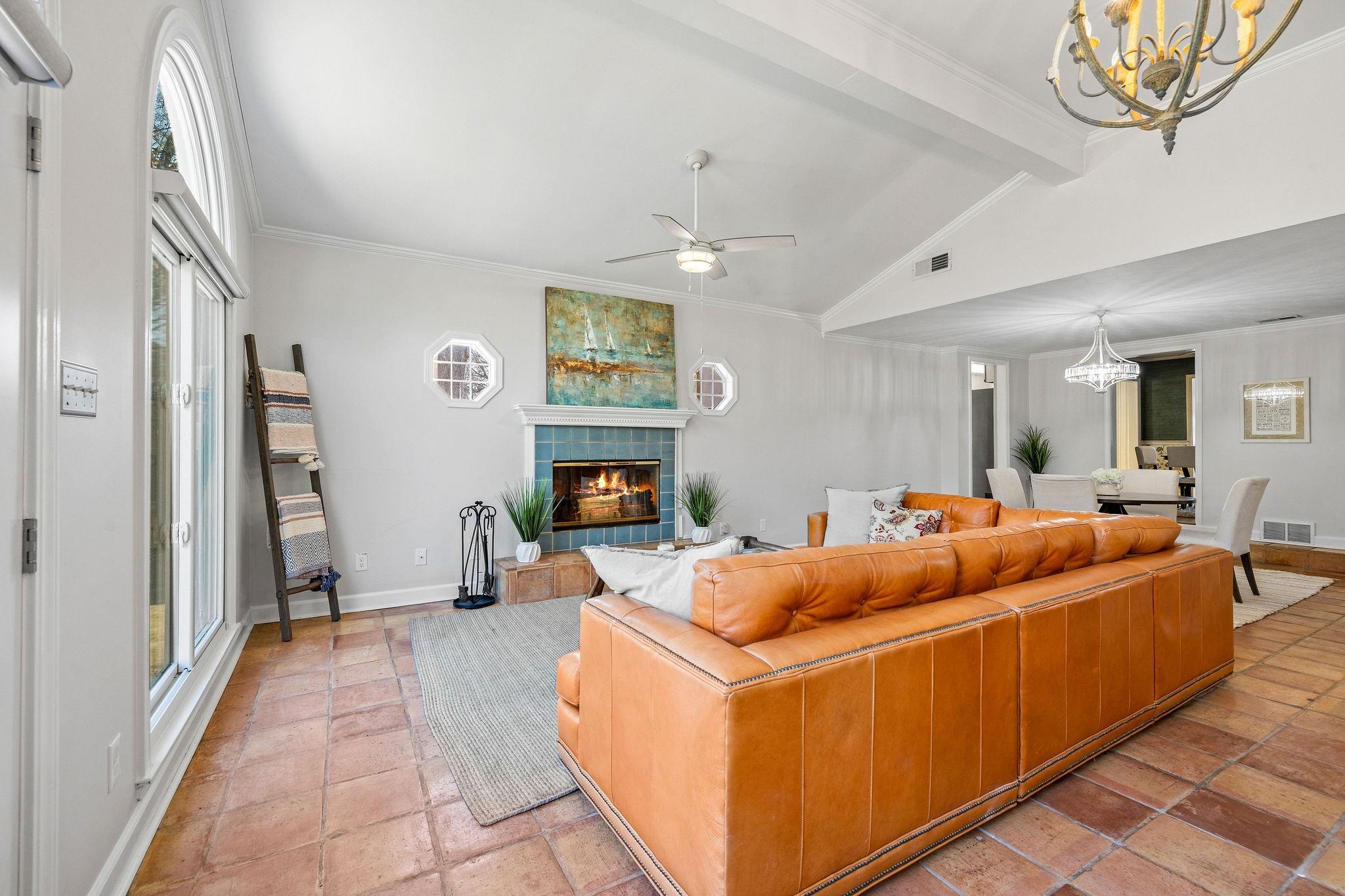 1002 Kings Park Road Memphis, TN 38117 - Photo 19 of 40 a living room with furniture a fireplace and a large window