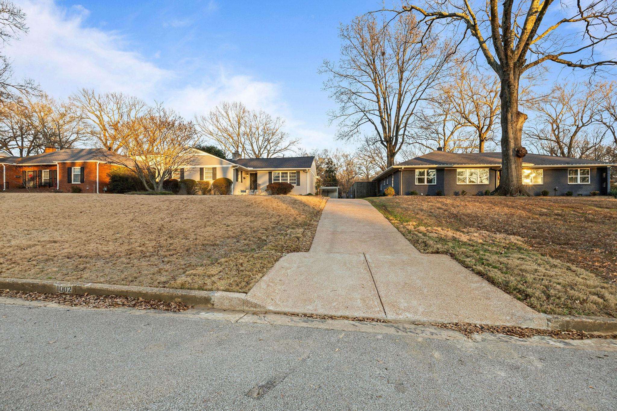 1002 Kings Park Road Memphis, TN 38117 - Photo 2 of 40 front view of a house with a yard