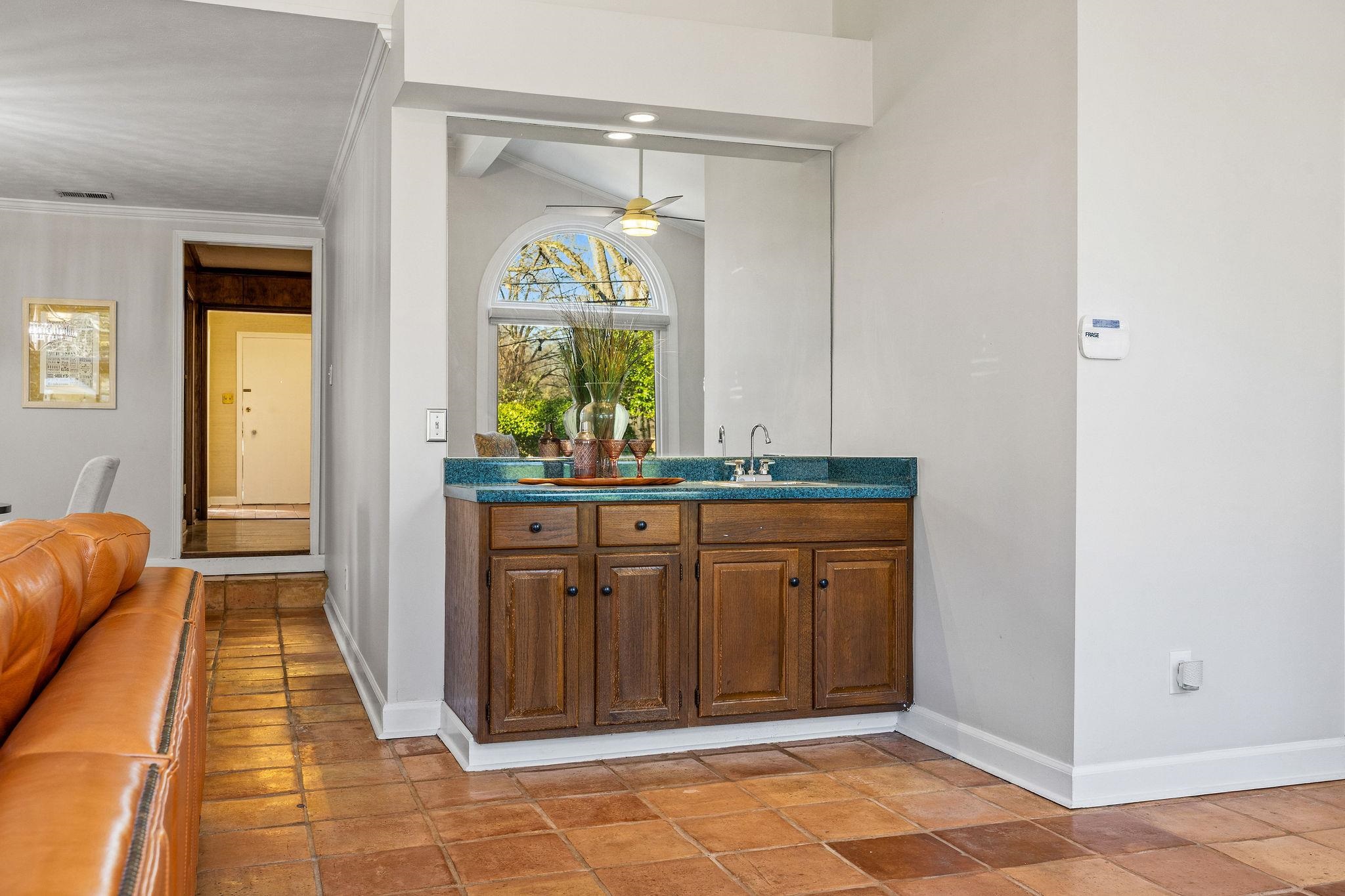 1002 Kings Park Road Memphis, TN 38117 - Photo 21 of 40 a bathroom with a granite countertop sink and a mirror