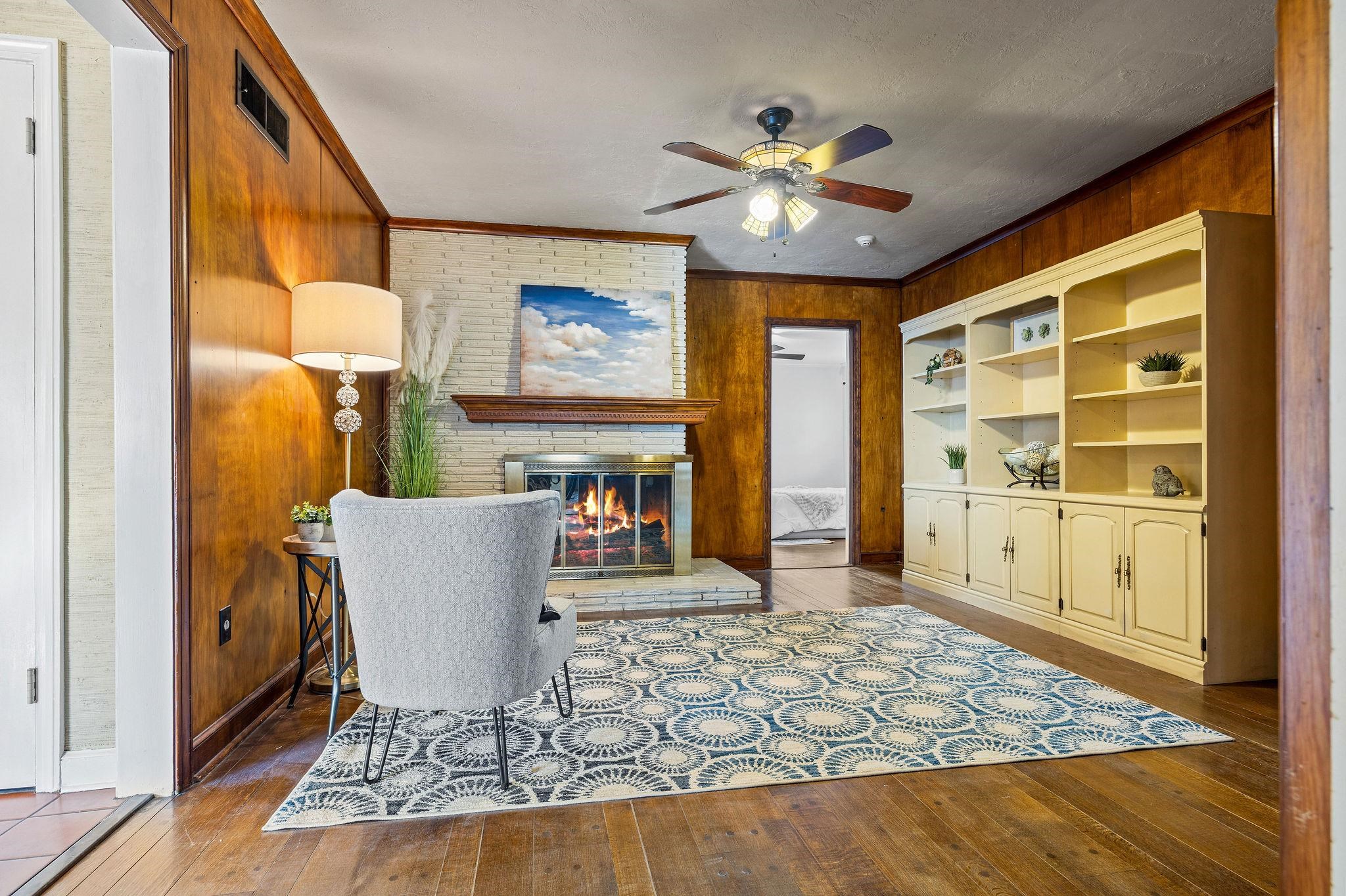 1002 Kings Park Road Memphis, TN 38117 - Photo 24 of 40 a living room with furniture and a fireplace