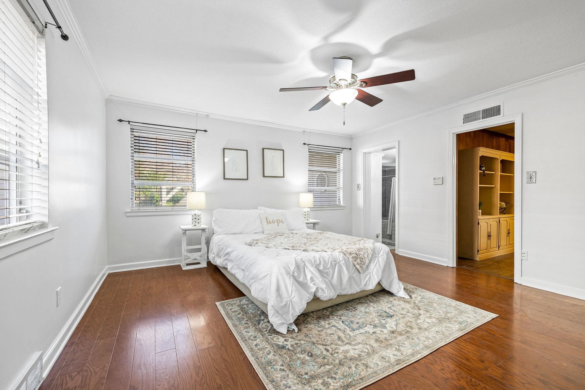 1002 Kings Park Road Memphis, TN 38117 - Photo 26 of 40 a bedroom with a bed and wooden floor