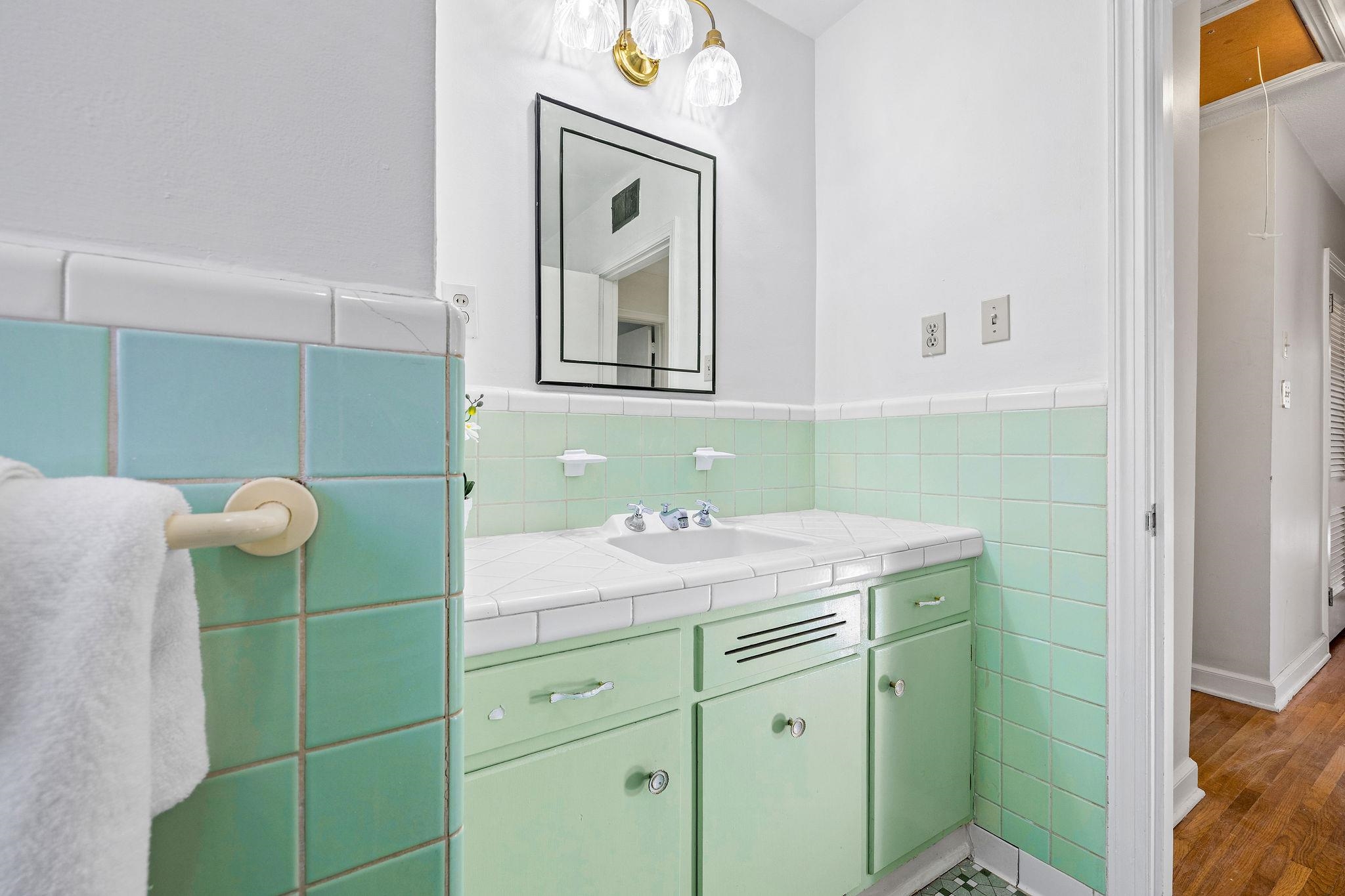 1002 Kings Park Road Memphis, TN 38117 - Photo 35 of 40 a bathroom with a sink and a mirror