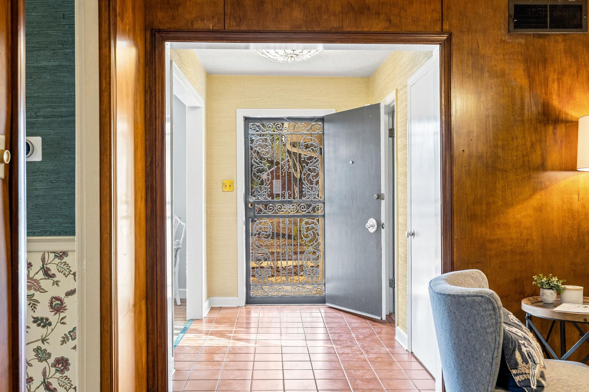 1002 Kings Park Road Memphis, TN 38117 - Photo 5 of 40 a view of a hallway with furniture and front door