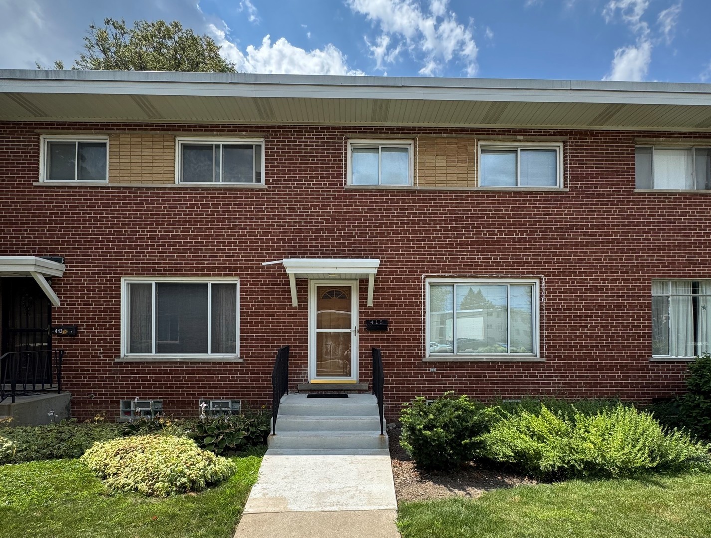 415 East Lincoln Street Mount Prospect, IL 60056 - Photo 1 of 10 a front view of a house with a yard