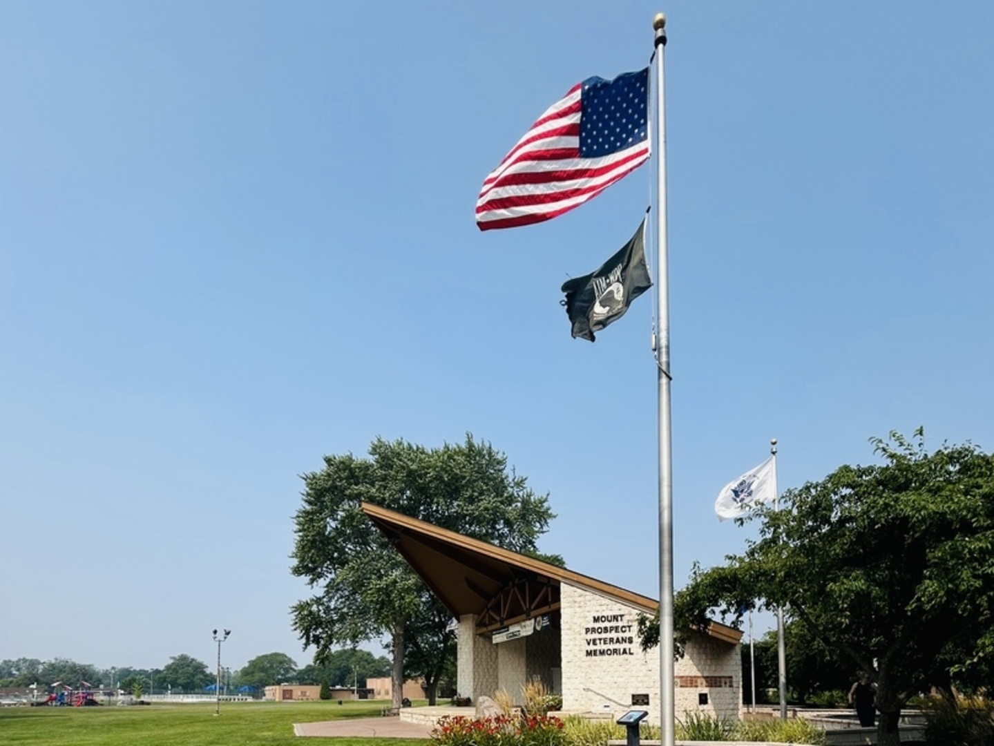 415 East Lincoln Street Mount Prospect, IL 60056 - Photo 6 of 10 a front view of a house with a yard and garage