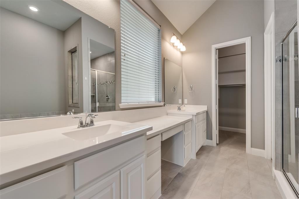 3916 Ironbark Way McKinney, TX 75071 - Photo 19 of 23 a bathroom with a sink double vanity and a mirror