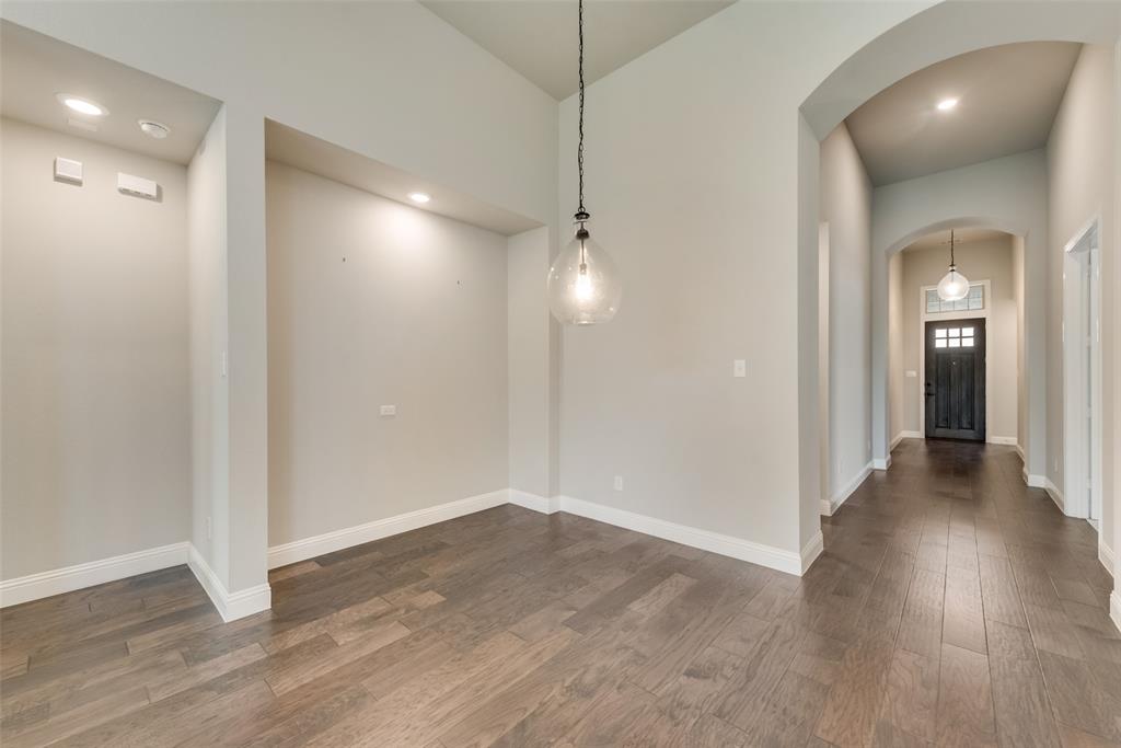 3916 Ironbark Way McKinney, TX 75071 - Photo 5 of 23 a view of a hallway with wooden floor