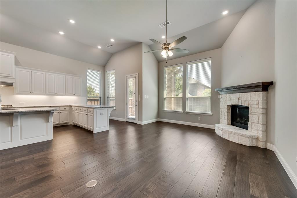 3916 Ironbark Way McKinney, TX 75071 - Photo 6 of 23 a view of an empty room with a fireplace and a window