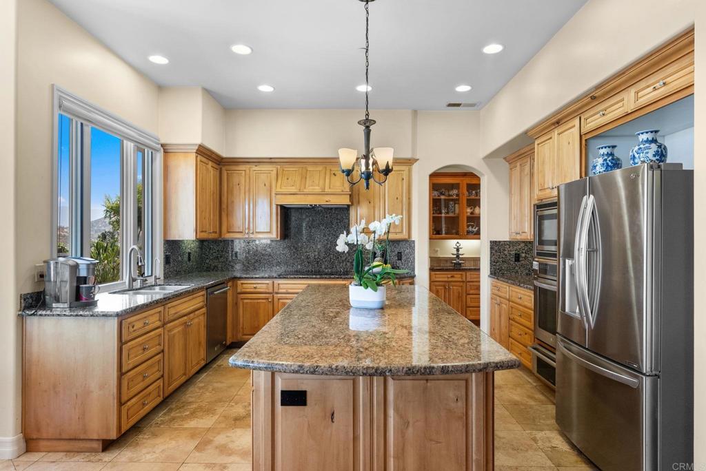 28820 Willow Park Road Escondido, CA 92026 - Photo 14 of 72 a kitchen with stainless steel appliances granite countertop a refrigerator a sink and a stove