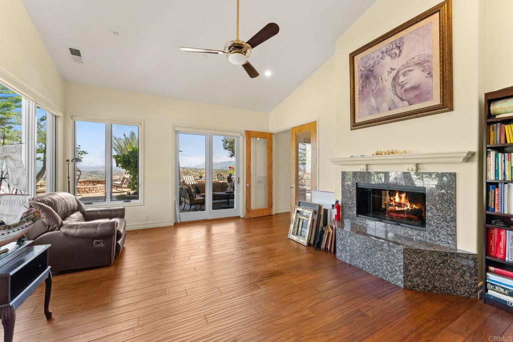 28820 Willow Park Road Escondido, CA 92026 - Photo 25 of 72 a living room with furniture and a fireplace or television