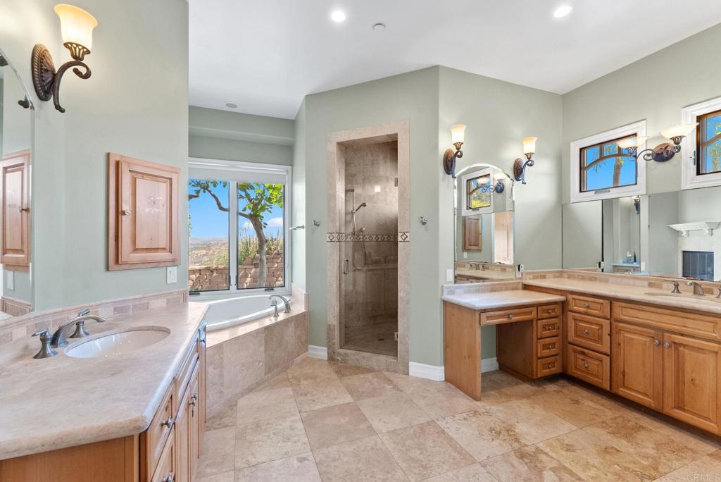 28820 Willow Park Road Escondido, CA 92026 - Photo 35 of 72 a spacious bathroom with a granite countertop sink a toilet a mirror and shower