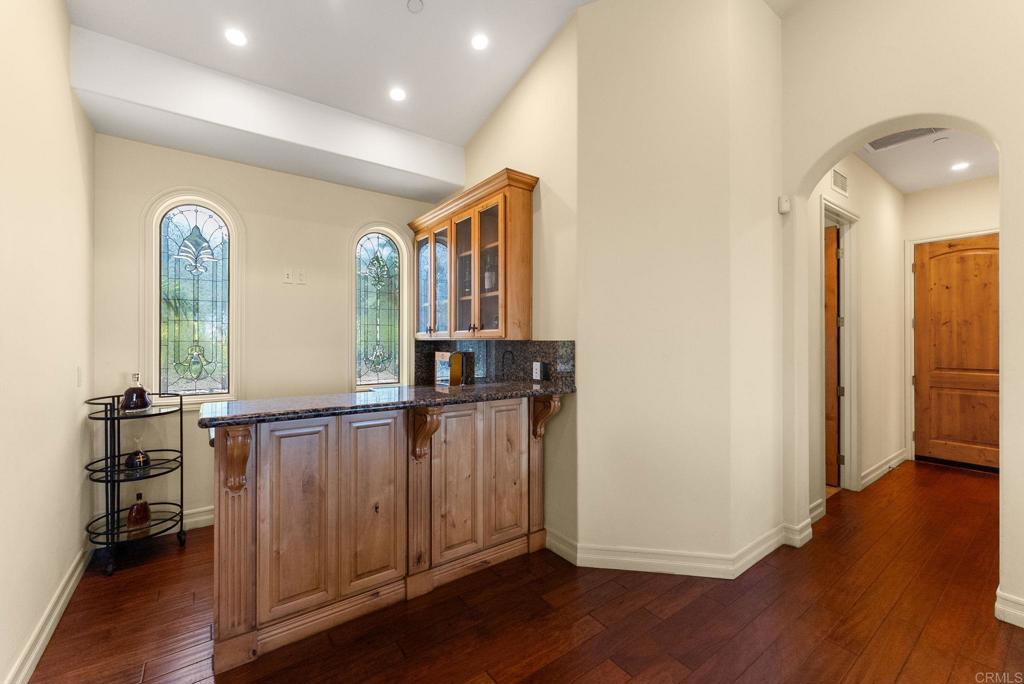 28820 Willow Park Road Escondido, CA 92026 - Photo 37 of 72 a view of a hallway with wooden floor and stairs