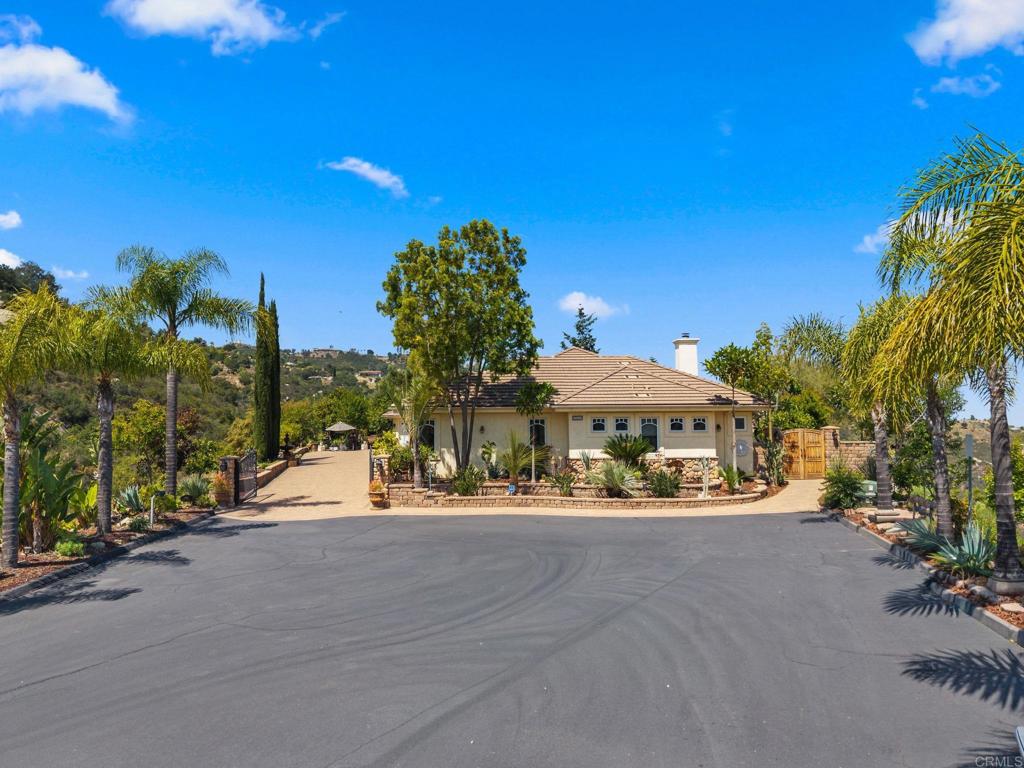 28820 Willow Park Road Escondido, CA 92026 - Photo 51 of 72 a front view of a house with a yard and lake view