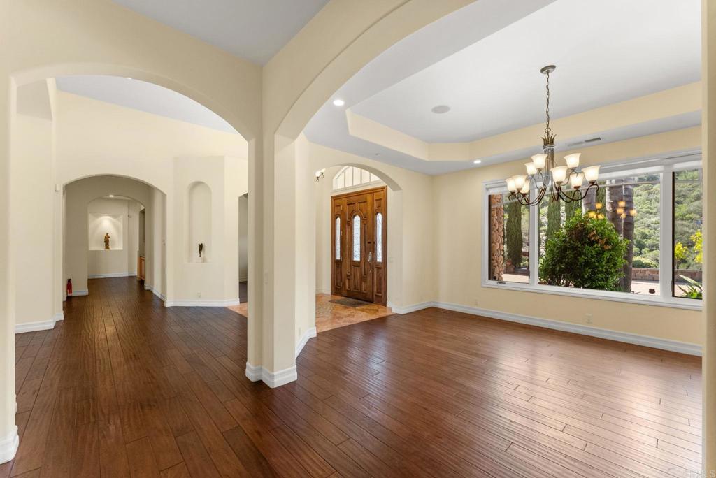 28820 Willow Park Road Escondido, CA 92026 - Photo 7 of 72 a view of a room with wooden floor chandelier and windows