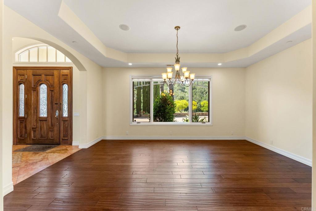 28820 Willow Park Road Escondido, CA 92026 - Photo 8 of 72 a view of an empty room with wooden floor and a window