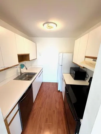 a kitchen with a sink and a window
