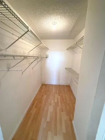 a view of a bathroom with a sink and a mirror