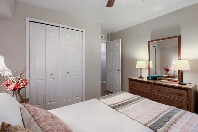 a bedroom with a bed and a dresser