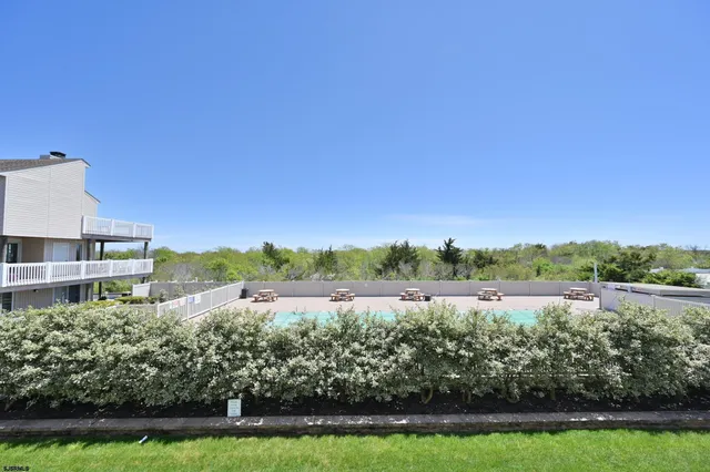 a view of a lake with houses in the back