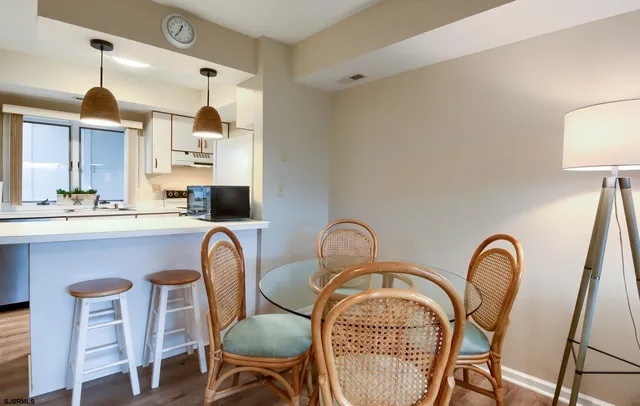 a dining room with furniture and window